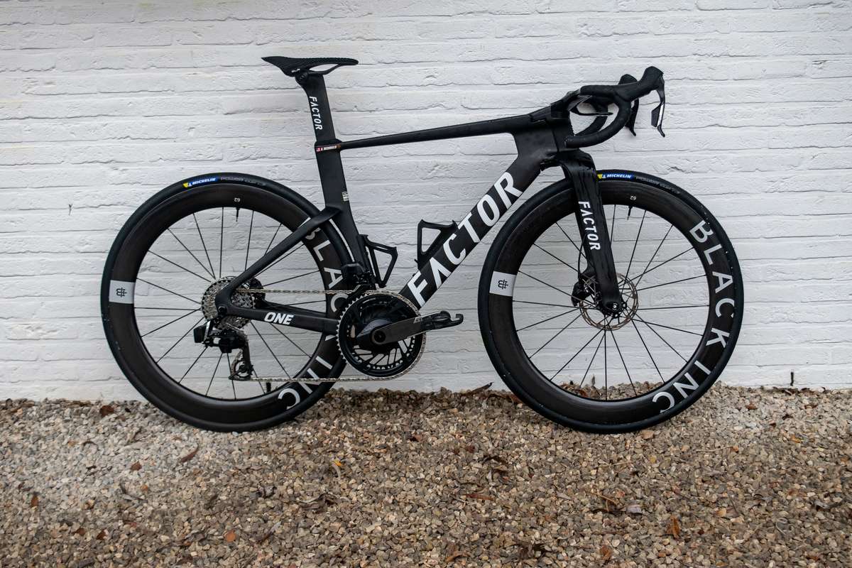 Close-up of an aerodynamic road bike frame used in the Tour de France showing tube shaping and integrated cockpit