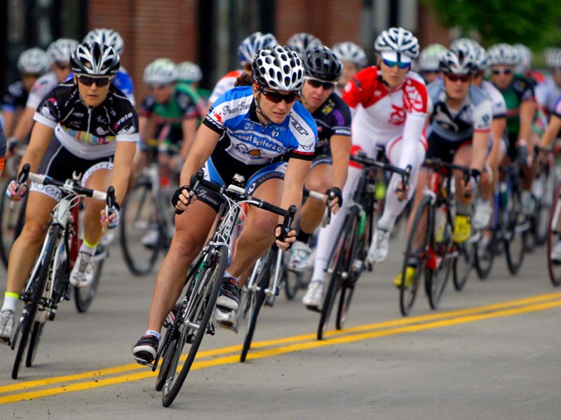 Three riders launching a coordinated attack off the front as the peloton hesitates