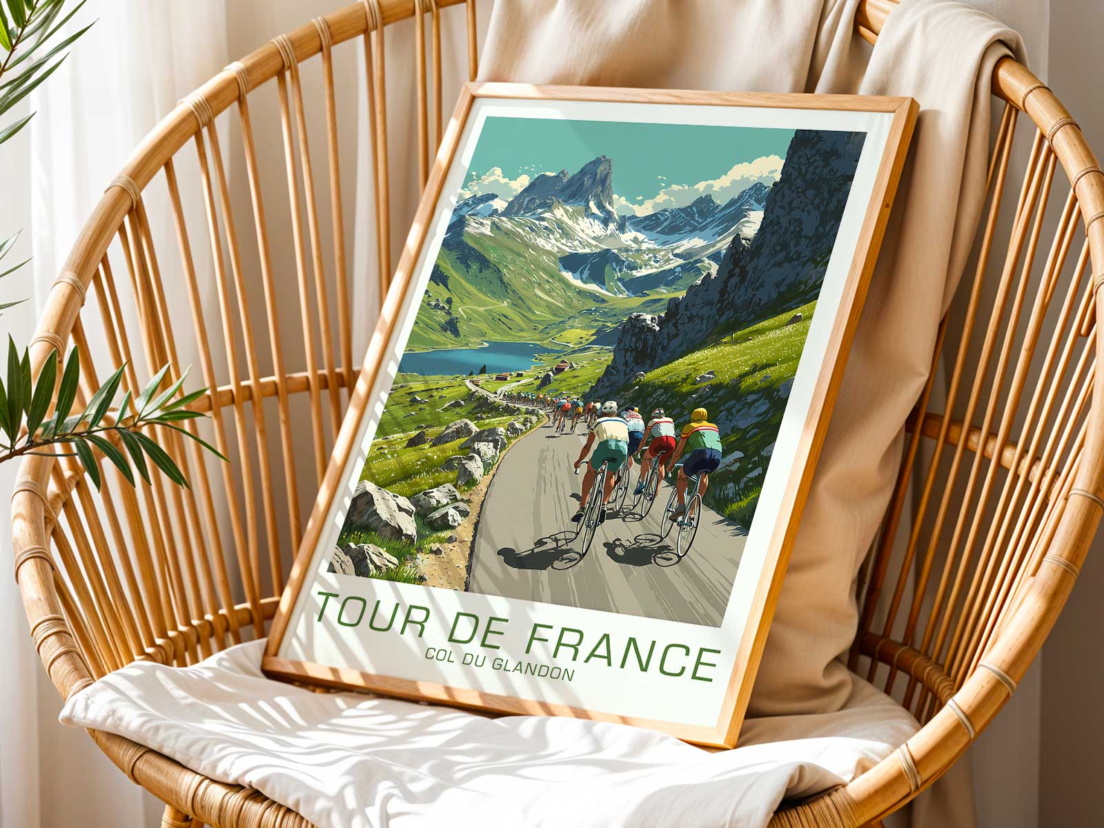 Close-up poster of a cyclist cresting a slope on the Col du Glandon, muscles strained and posture focused against mountain…
