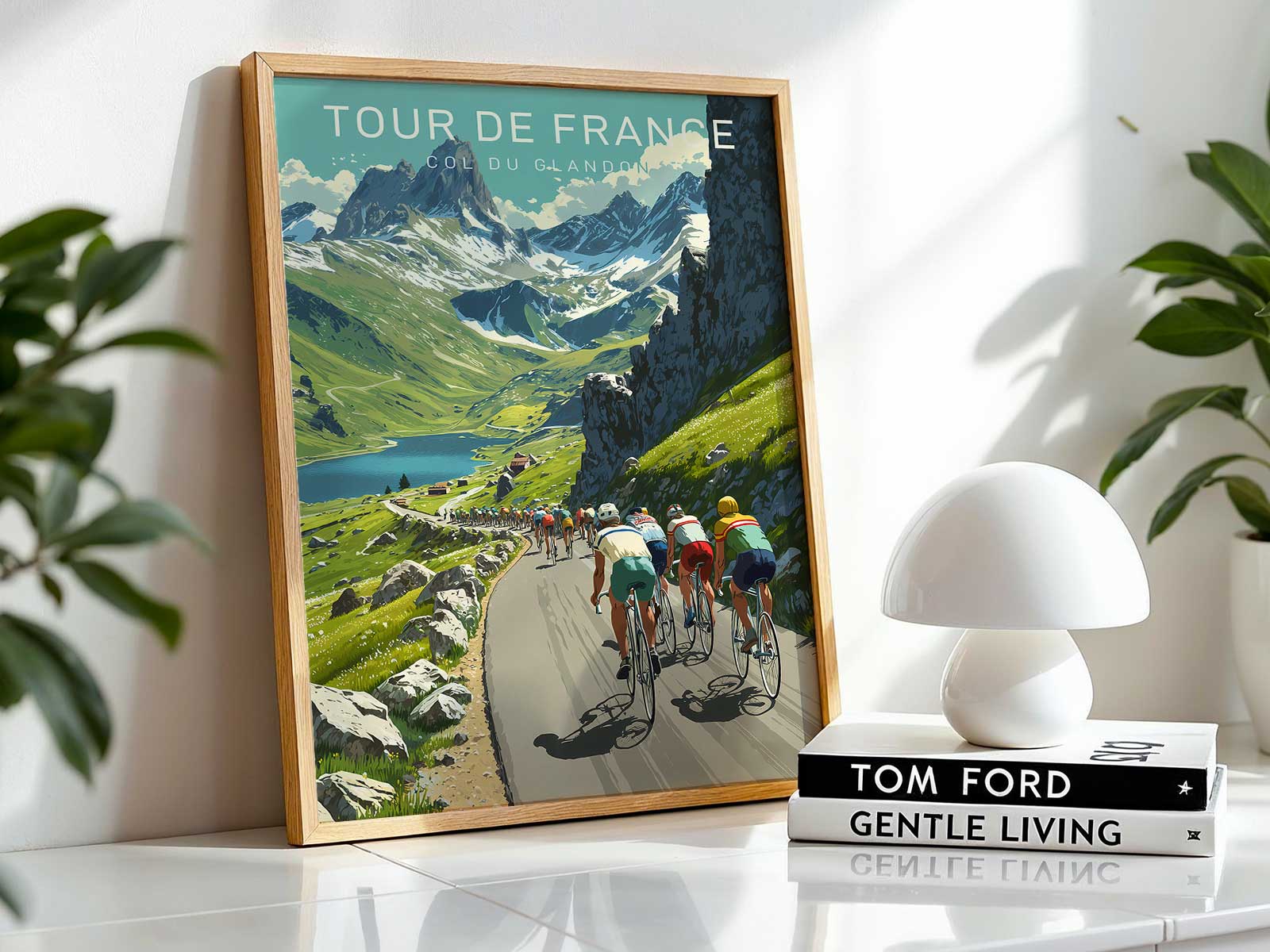 Panoramic composition of the Col du Glandon summit plateau under dramatic clouds and light, evoking an epic stage finish