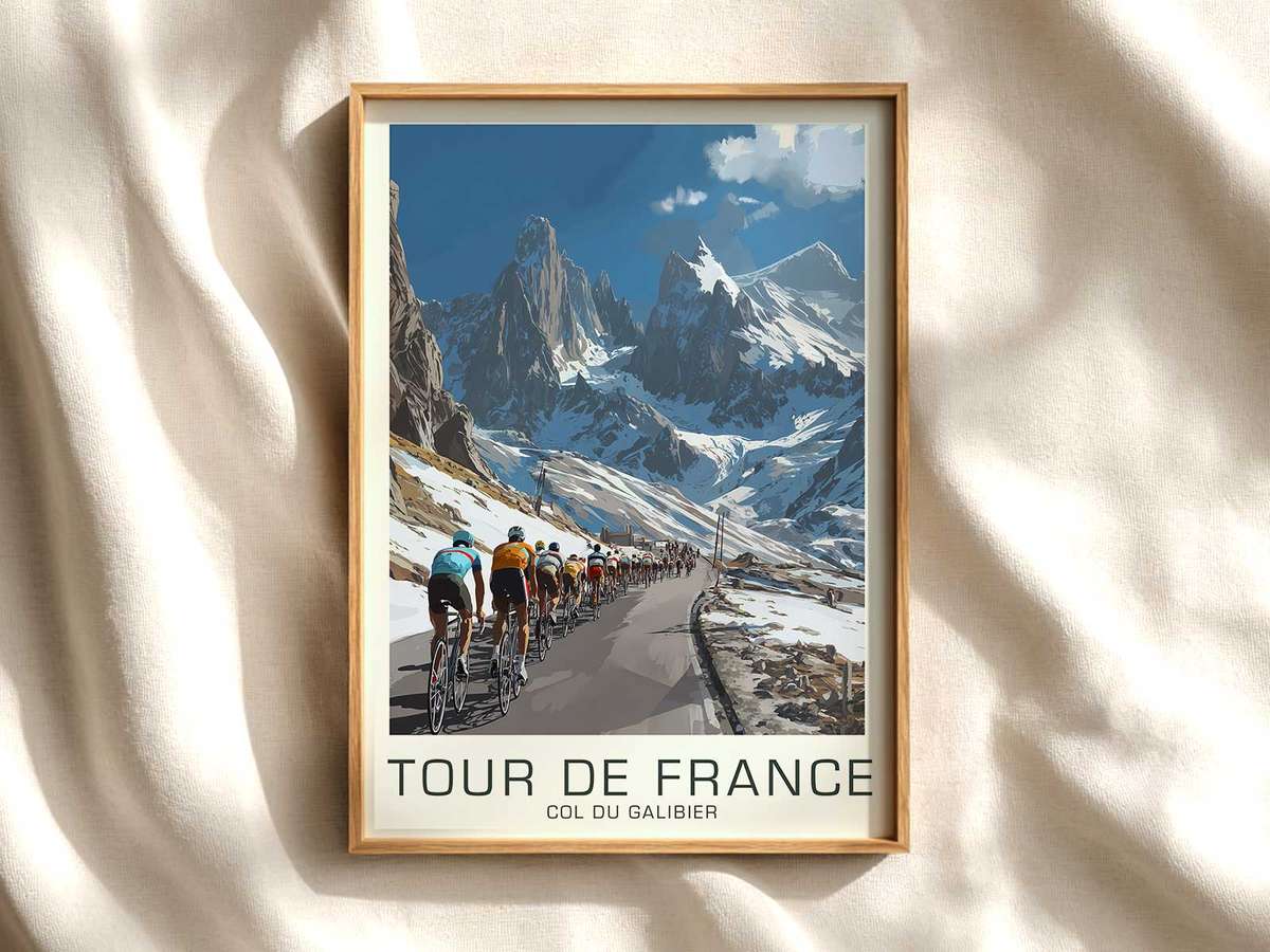 Side profile of a cyclist on Col du Galibier looking focused, hands on drops, road disappearing ahead