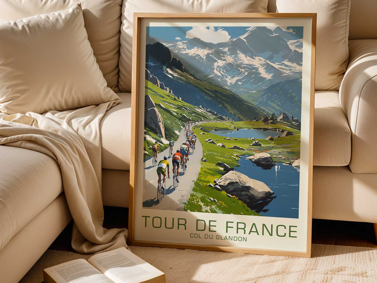 Wide panoramic composition of the Col du Glandon climb with a peloton shrinking into the mountain curves
