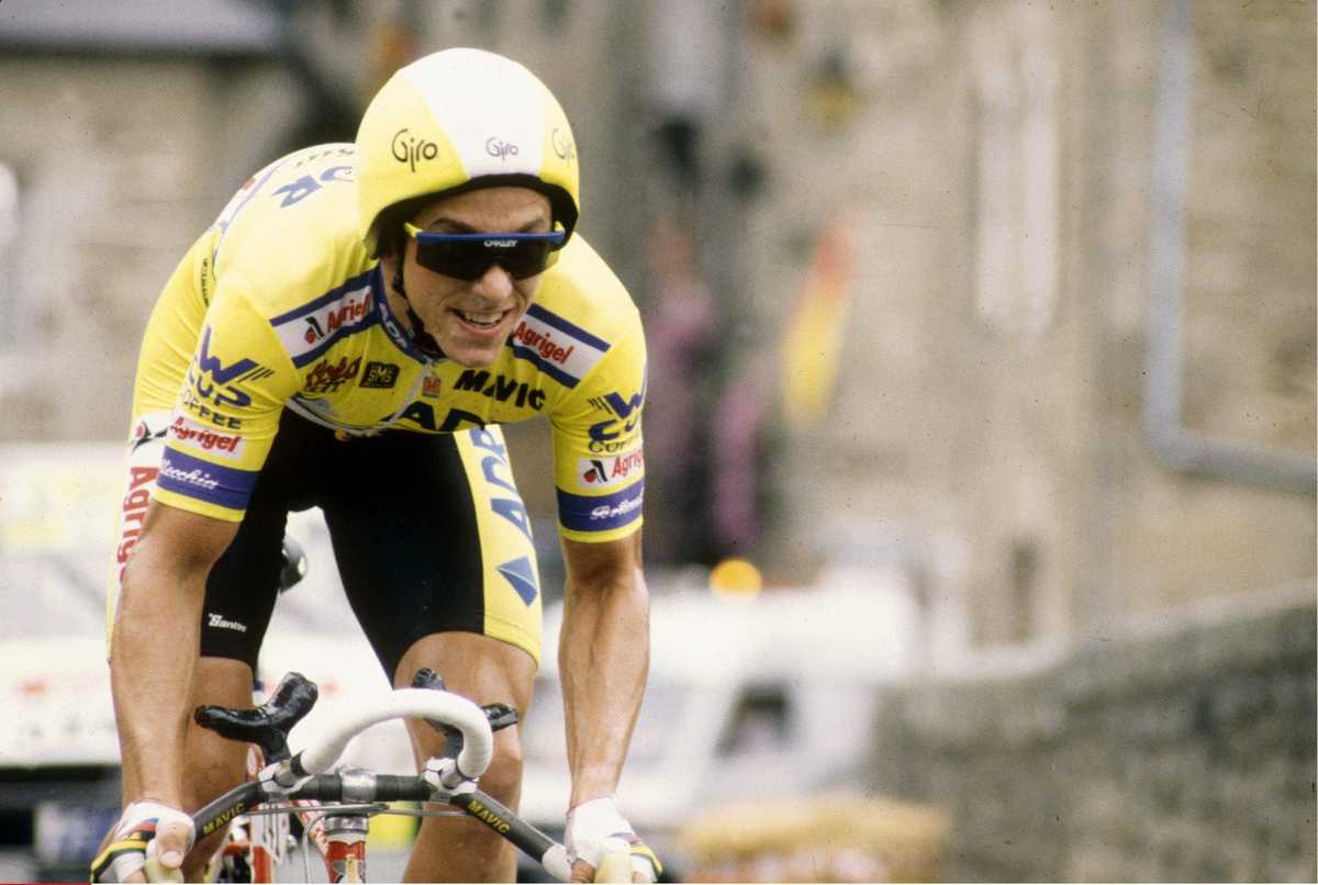 Greg LeMond in aerodynamic time trial position riding a sleek time trial bike during the Tour de France