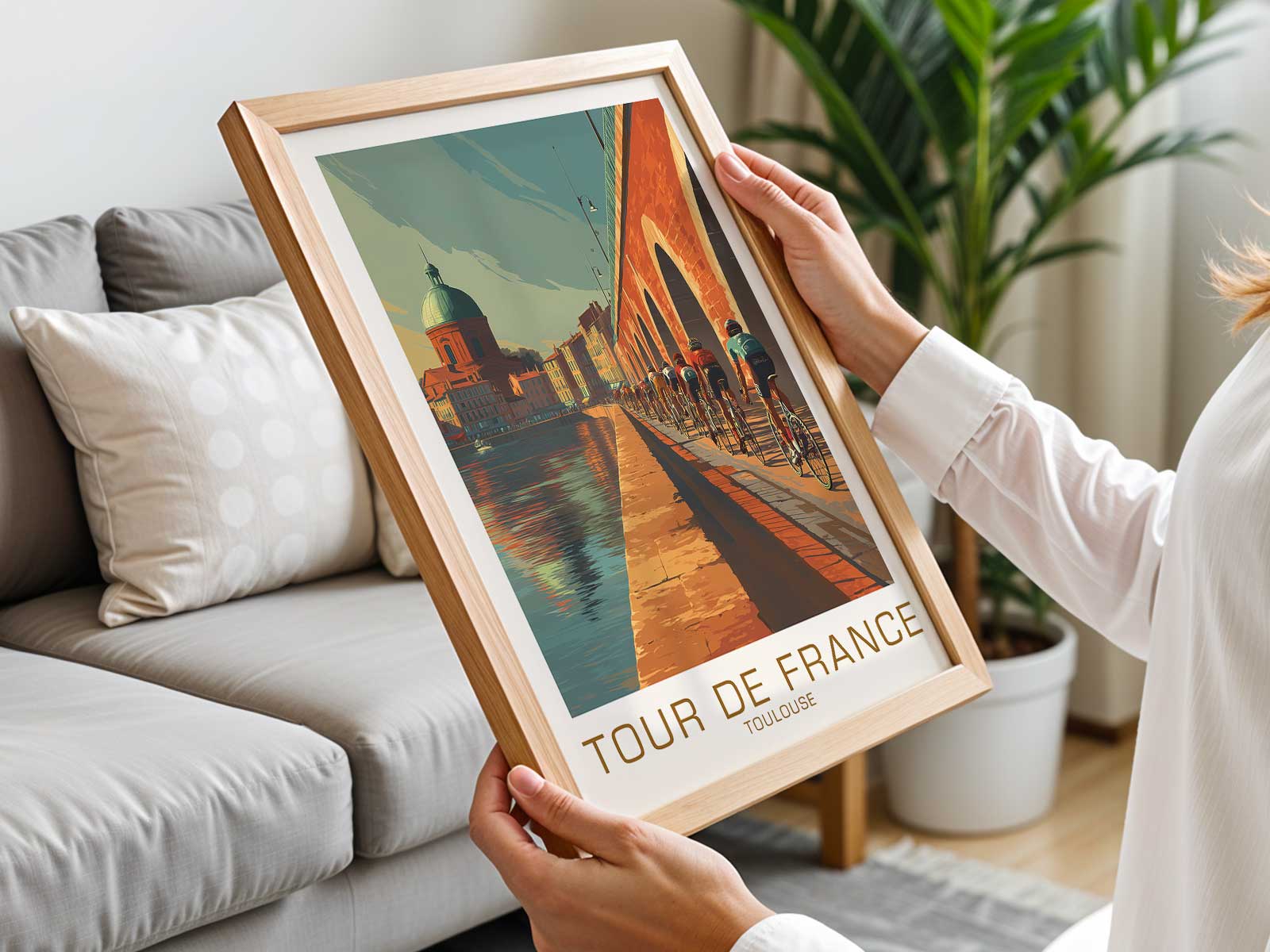 Single rider crossing a historic Toulouse bridge with arches and warm masonry forming a graphic urban backdrop