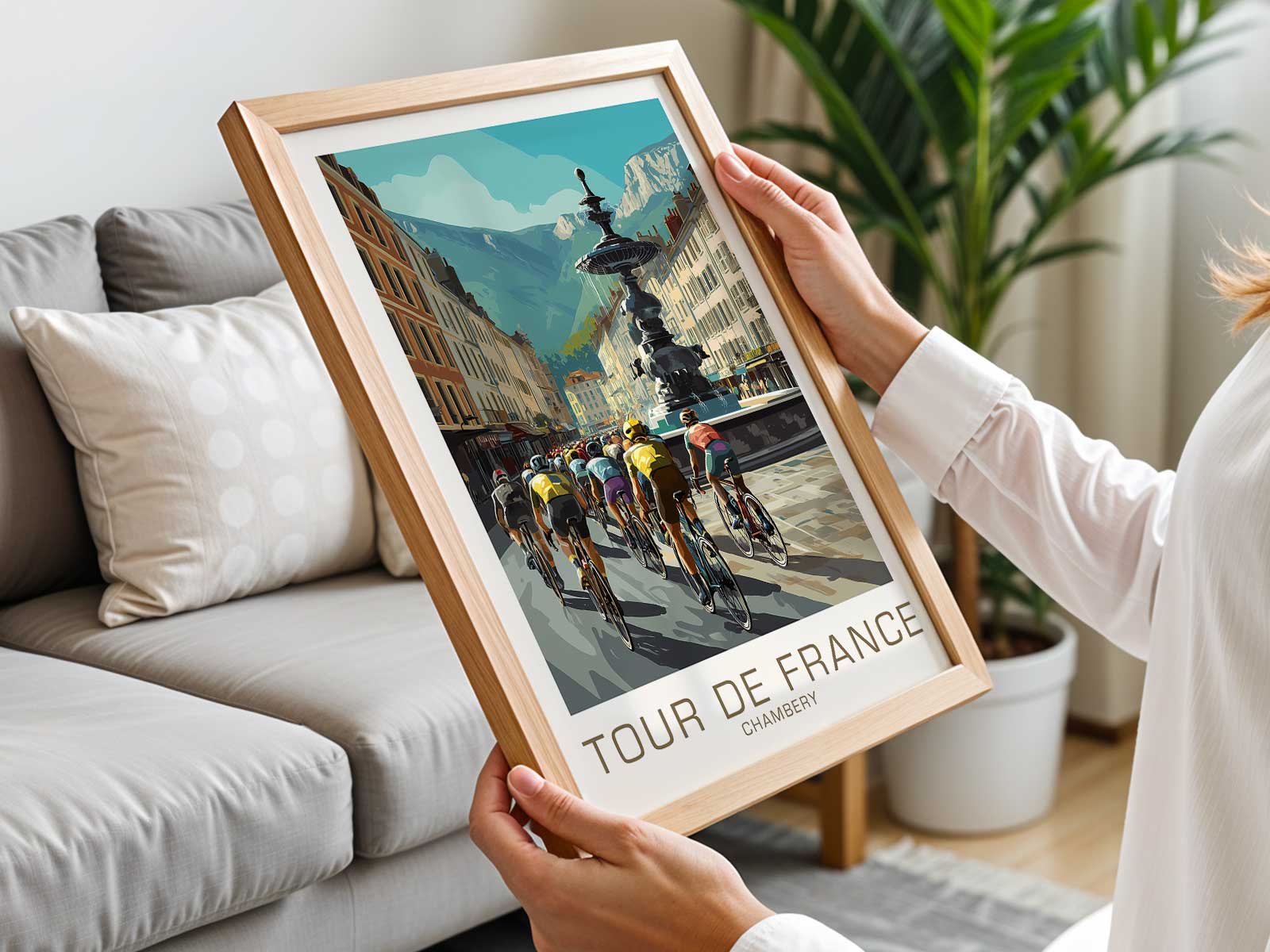Illustrated cyclists passing Chambéry landmarks with mountain backdrop in classic poster composition
