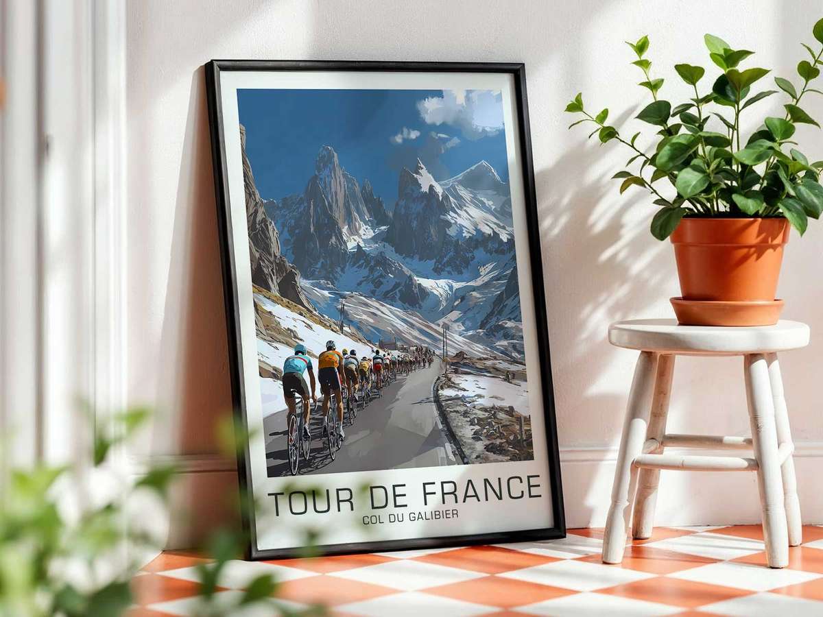 Silhouette of a cyclist seated on the saddle against the pale sky of Col du Galibier, road line cutting through foreground