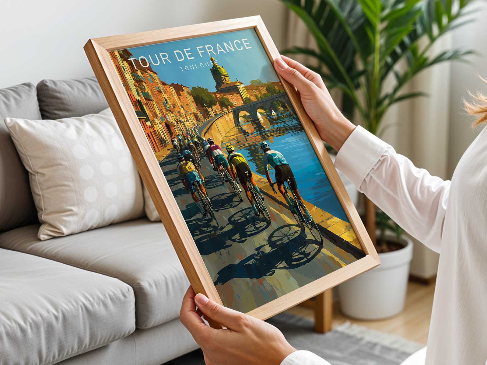 Full view of a vintage Tour de France poster featuring Toulouse landmarks, warm archival paper tones and an illustrated…