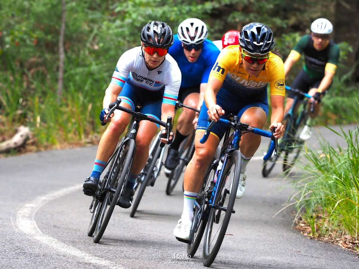 Domestique riding hard at the front on a flat section to shelter the team leader