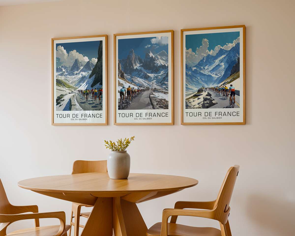 Retro poster style silhouette of a cyclist cresting the Col du Galibier summit with mountain ridges and a pale sky